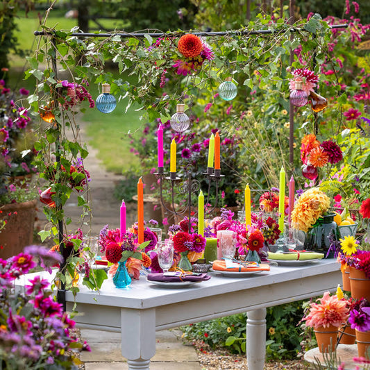 Bud vases with coloured flowers